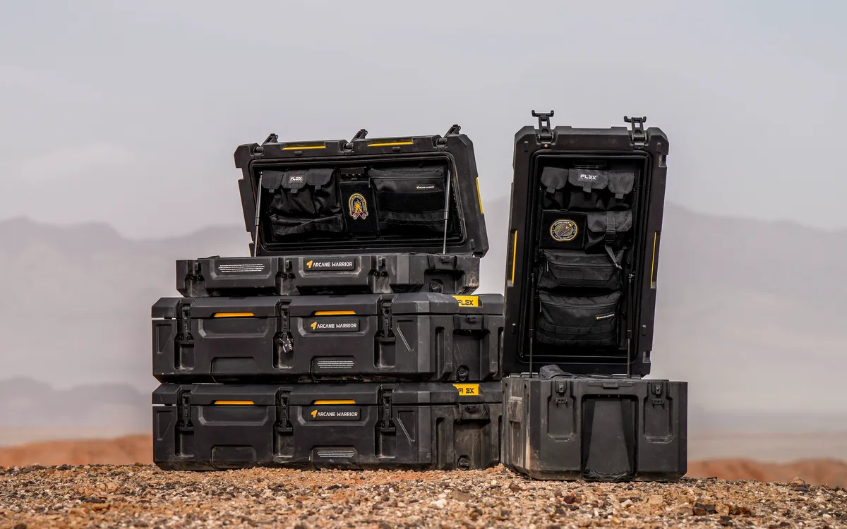 Arcane Warrior FLEX cargo cases stacked outdoors, with two open to show their organisers