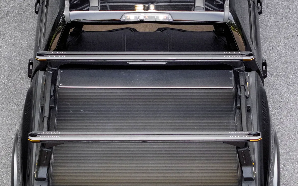 Two Arcane Warrior load bed rack crossbars fitted above a pickup load bed cover