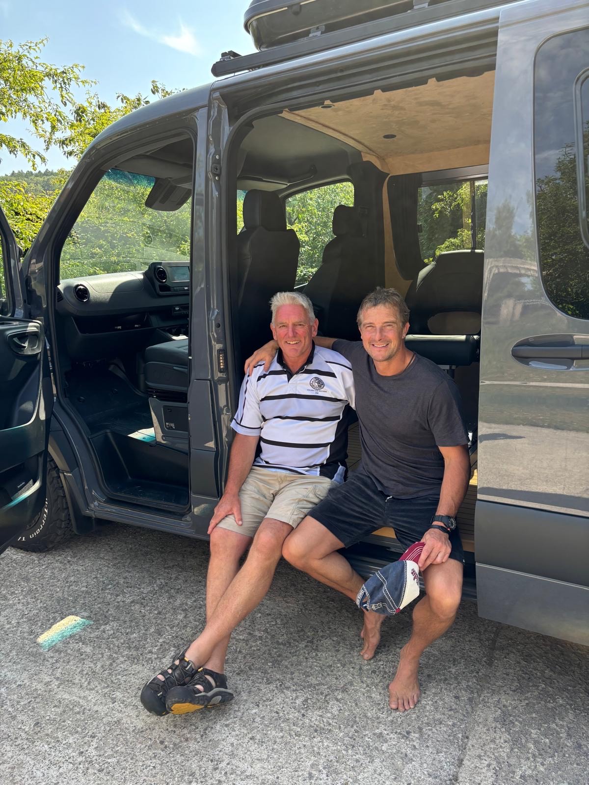 Neil Laughton and Bear Grylls with Apollo van