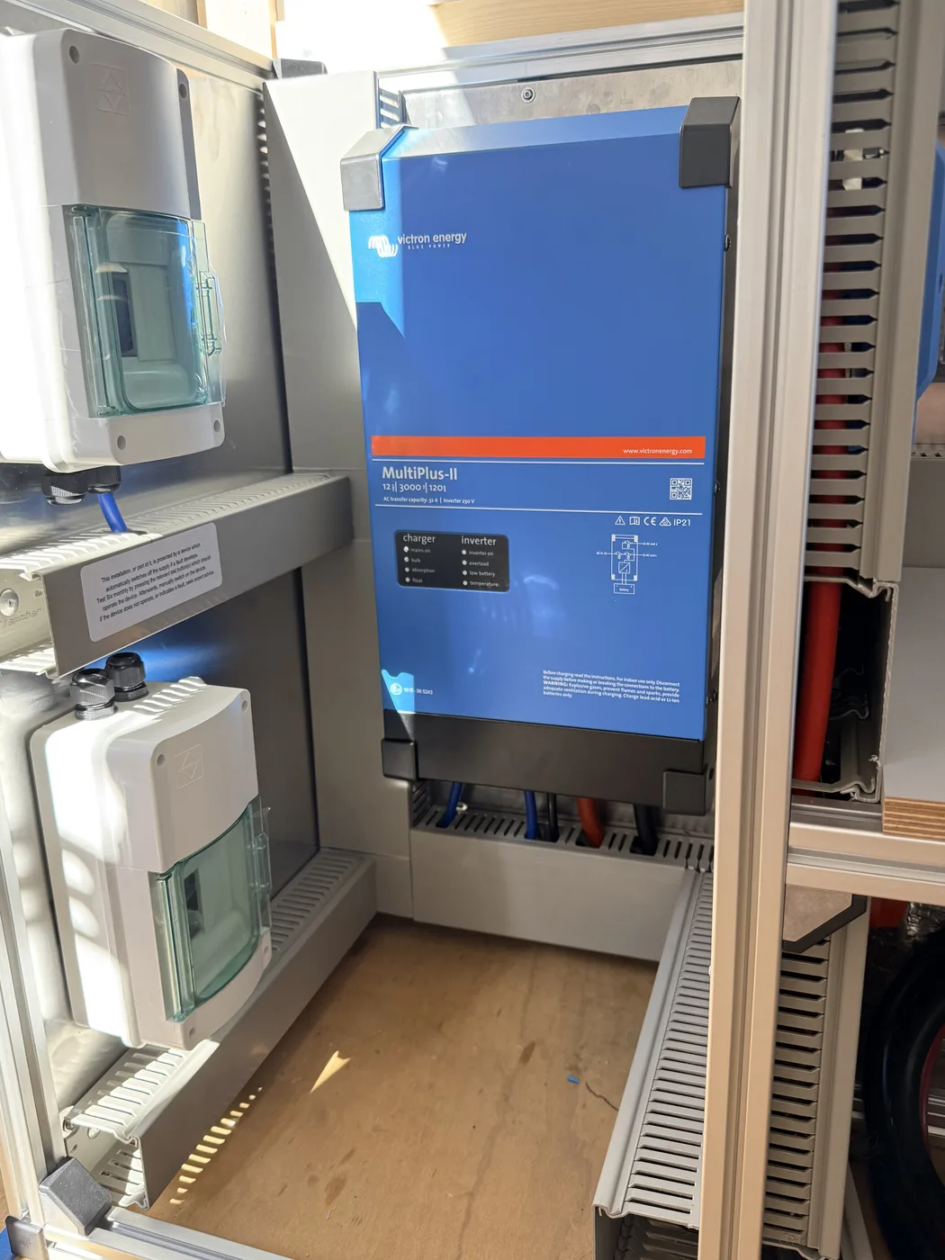 Close-up of the Victron MultiPlus-II 12/3000 inverter charger mounted on the Powerframe.